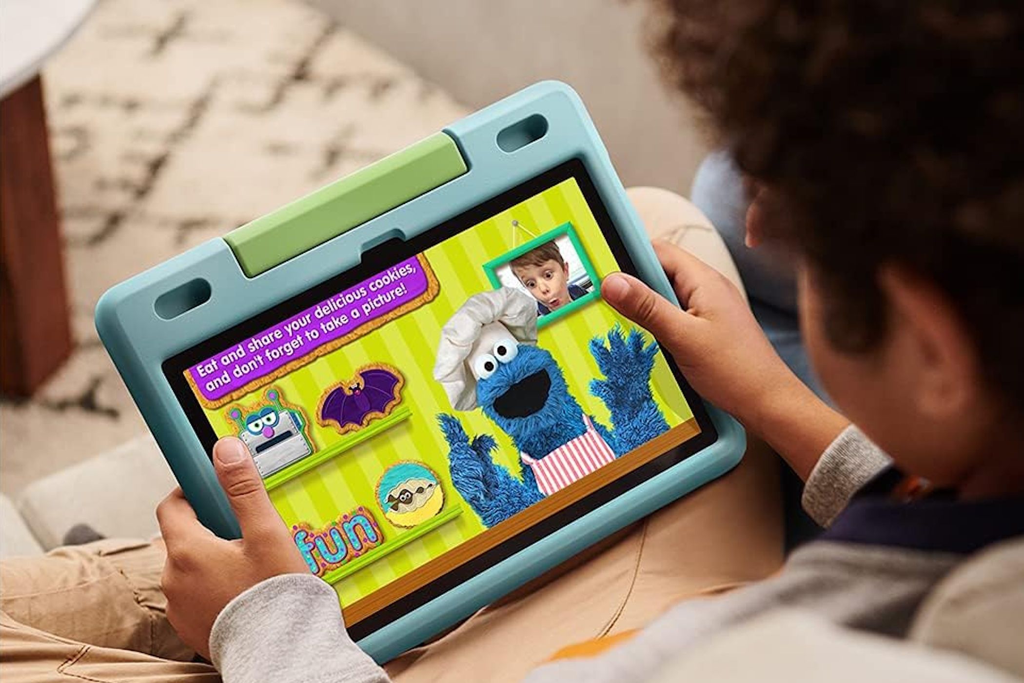 child playing cookie monster game on amazon fire hd 10 kids