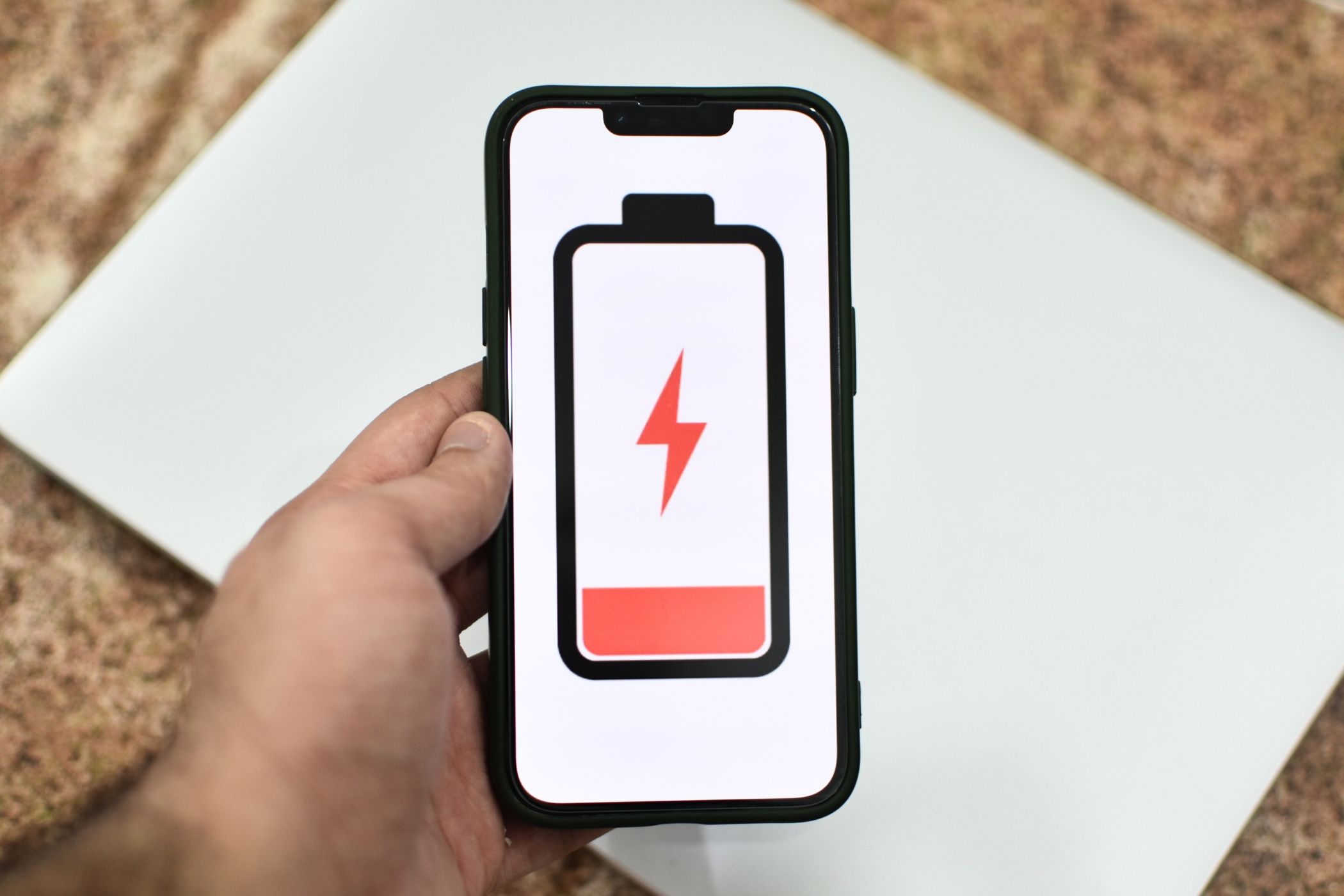 iPhone with illustration of an empty battery on the screen