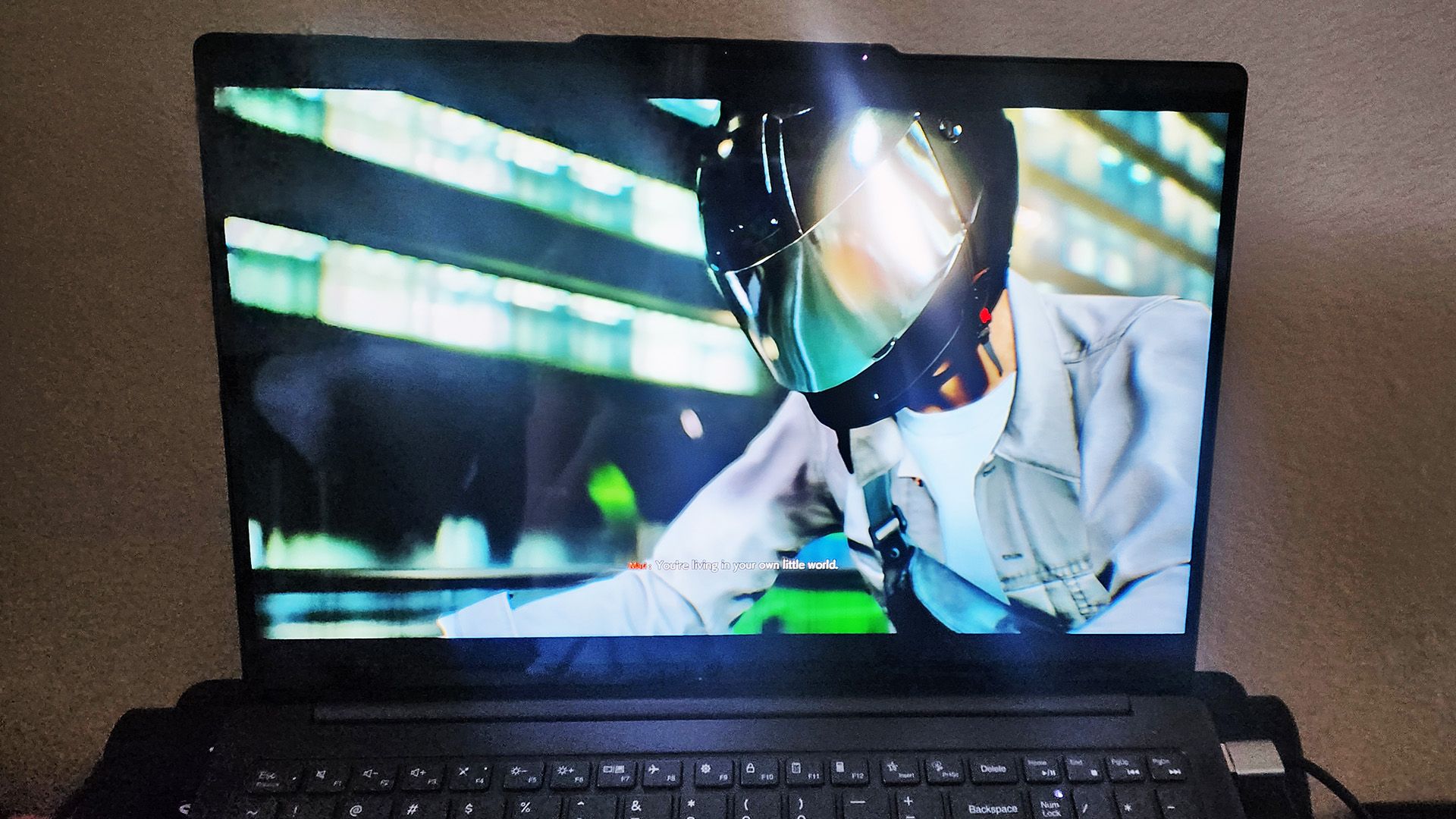 A photo of a virtual man on a motorcycle playing on the Lenovo Slim Pro 9i 16-inc Gen 8 laptop.