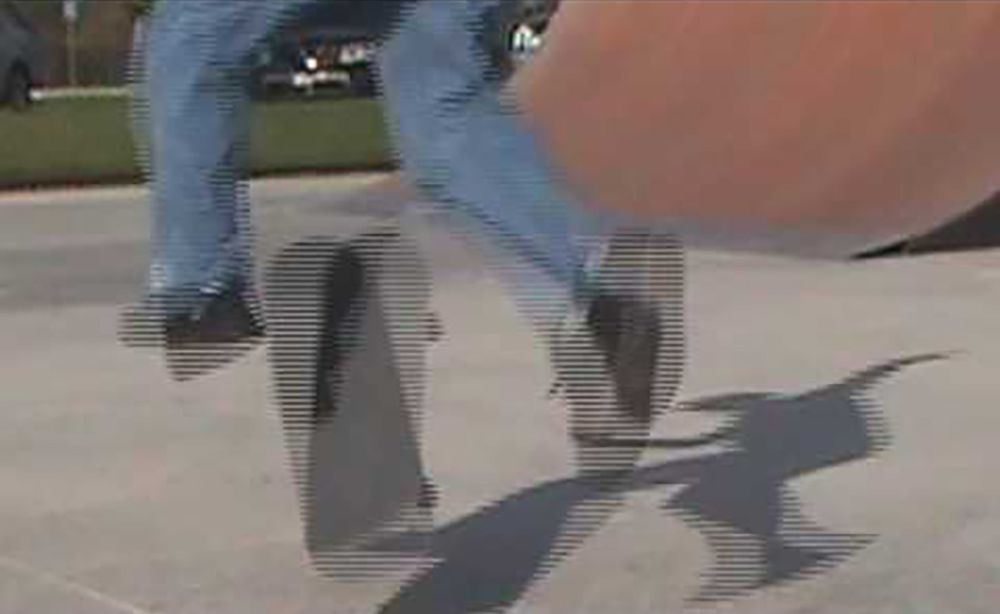 A video of someone doing a kickflip with a skateboard that has visible interlaced scanning lines.