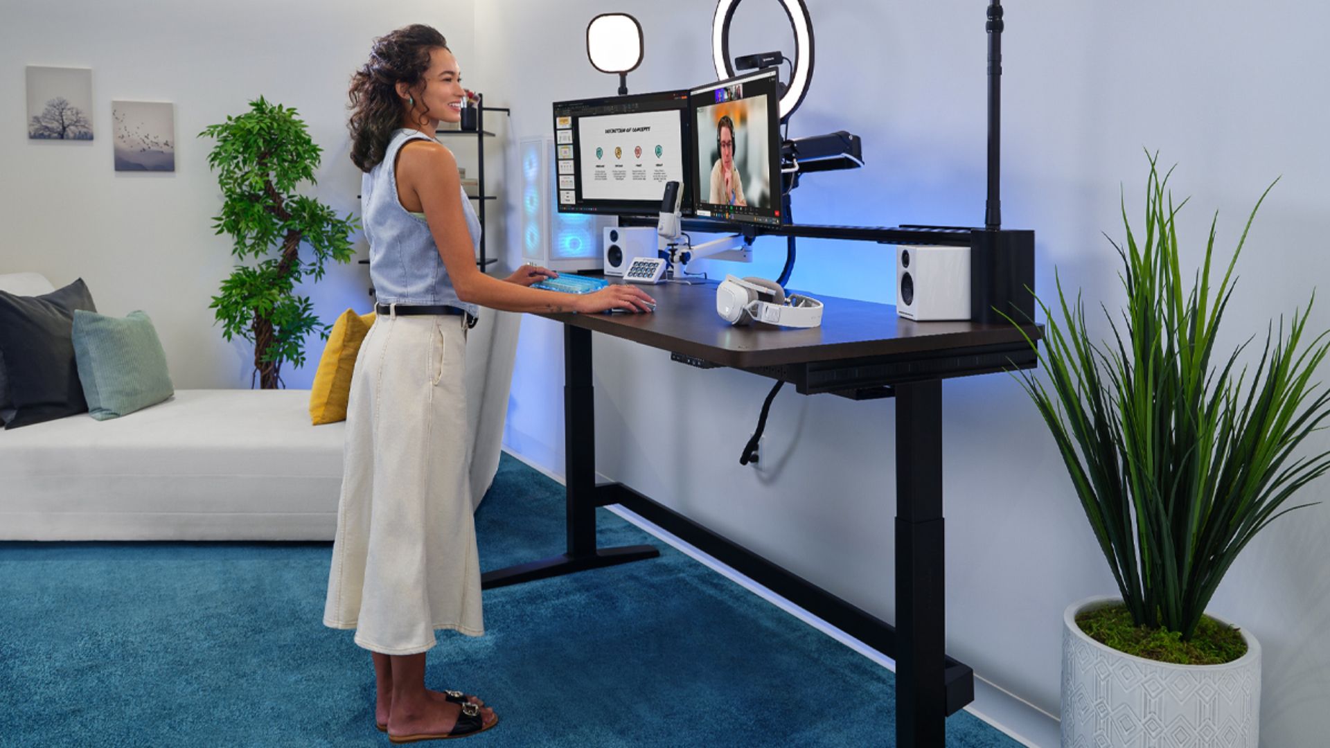 Woman working at the Corsair Platform:6 standing desk. 