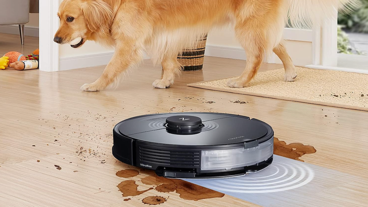 Roborock S7 Robot Vacuum and Mop cleaning up a spill with a golden retreiver in the background.