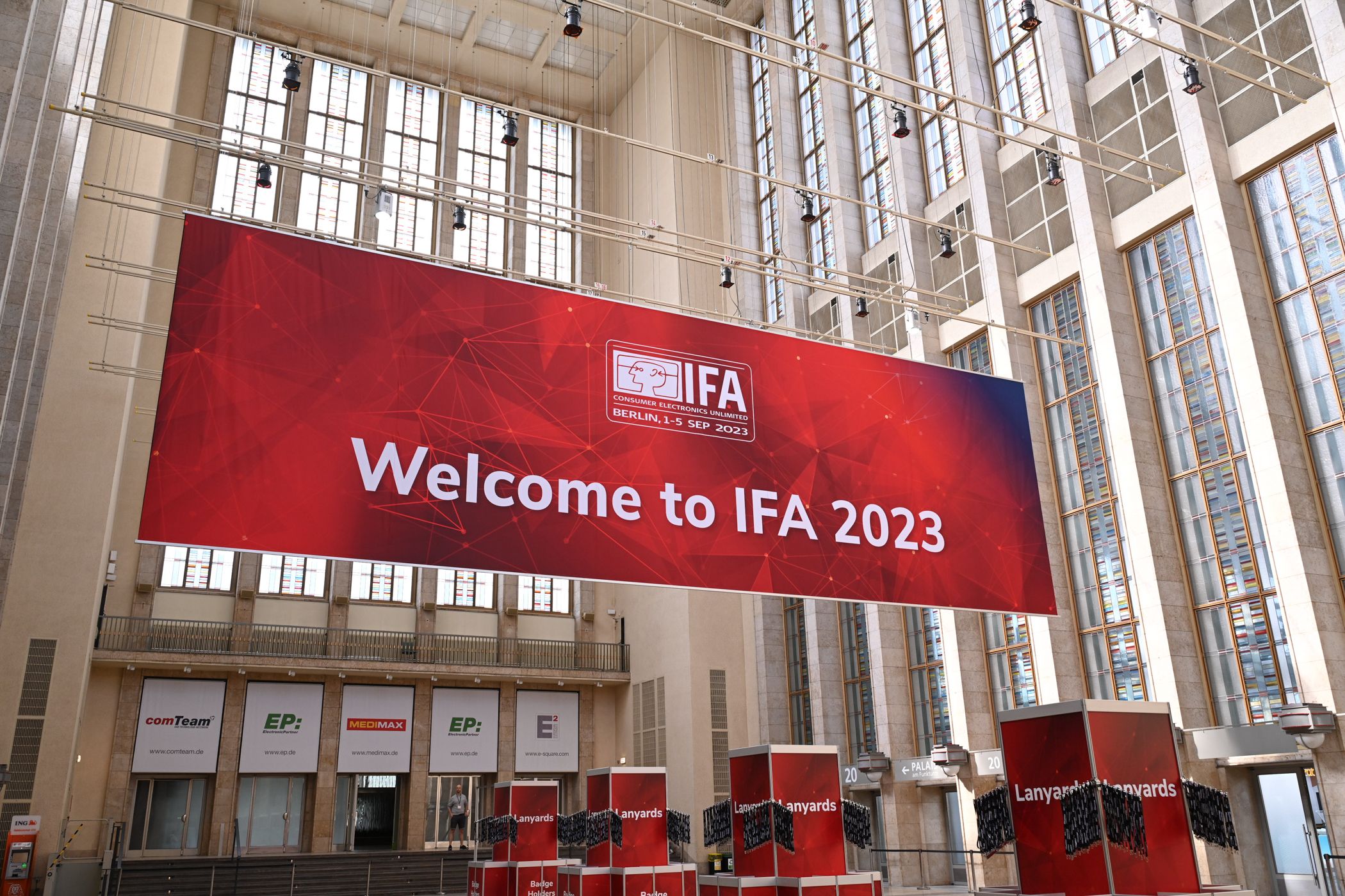 The north entrance of the IFA convention center with a large red banner.