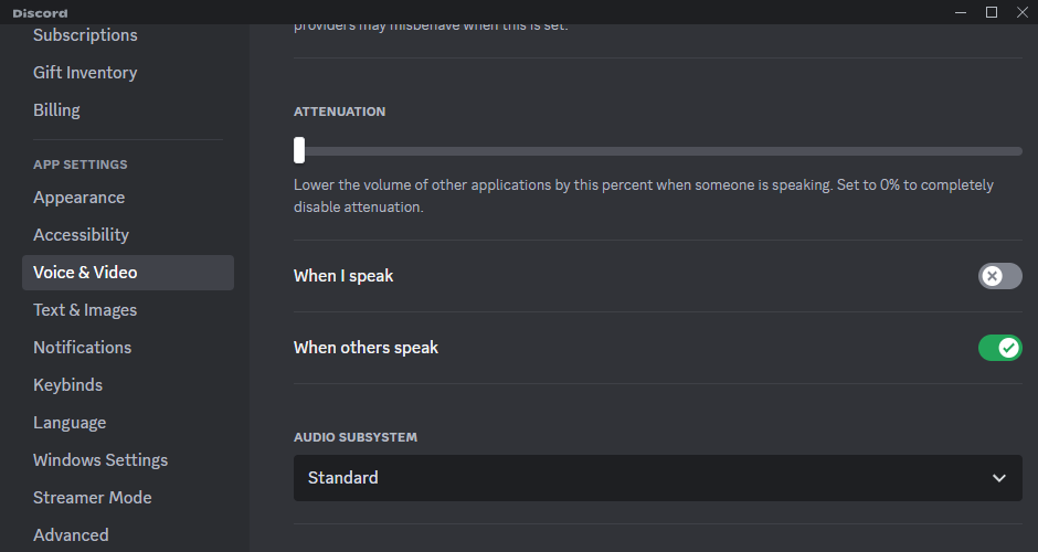 You can make Discord attenuate your volume automatically when you (or someone else) speak.