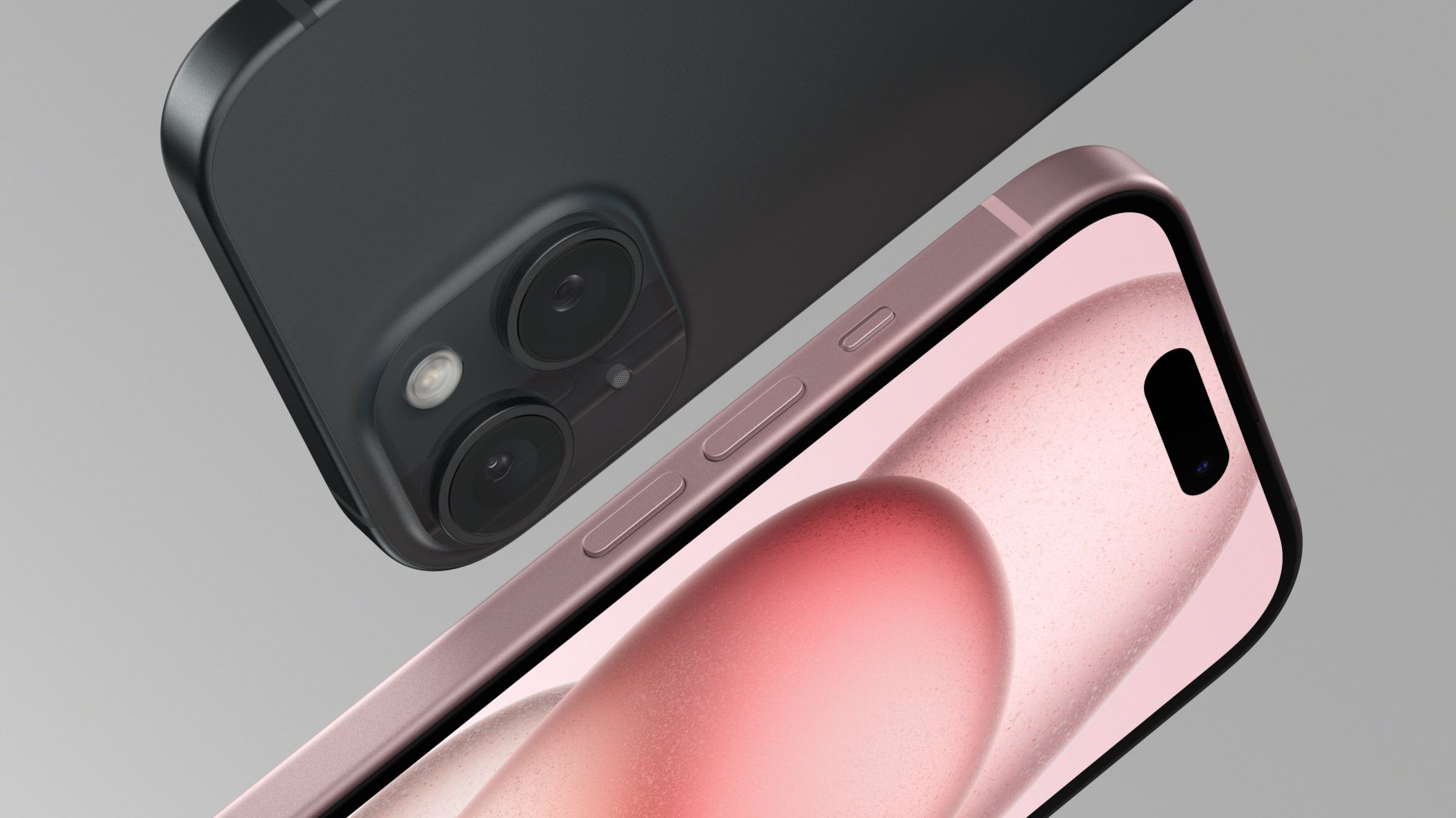 iPhone 15 in pink and black color over a gray background