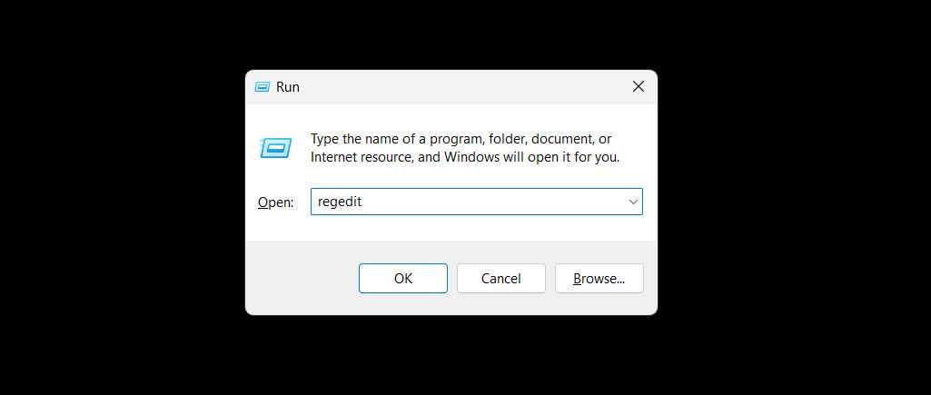 Launching the Registry Editor using the Run tool on Windows.