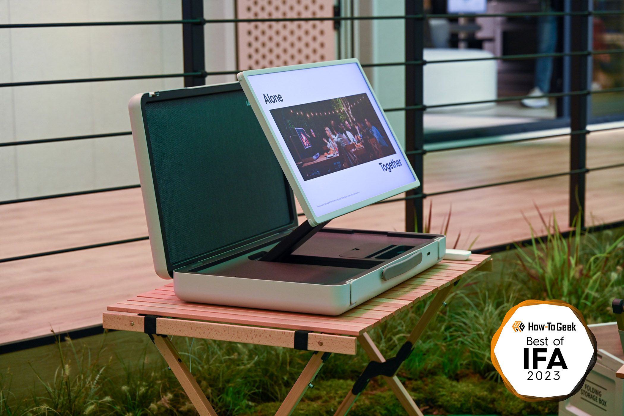 An LG TV folding out of a briefcase
