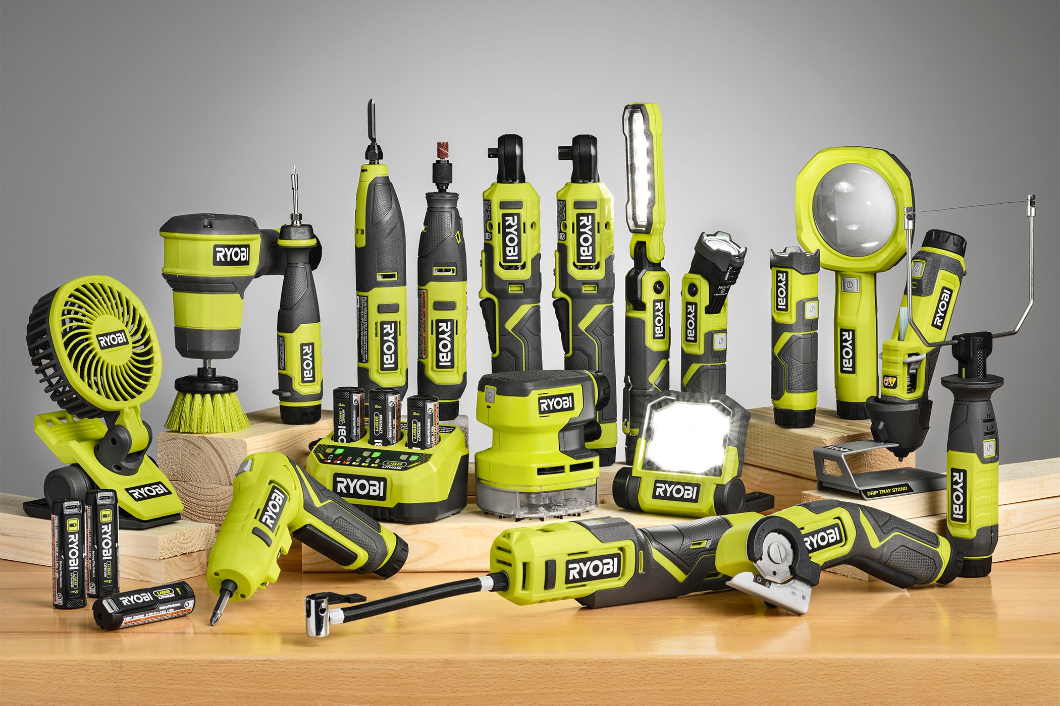 Ryobi USB Lithium family of products on a work bench.