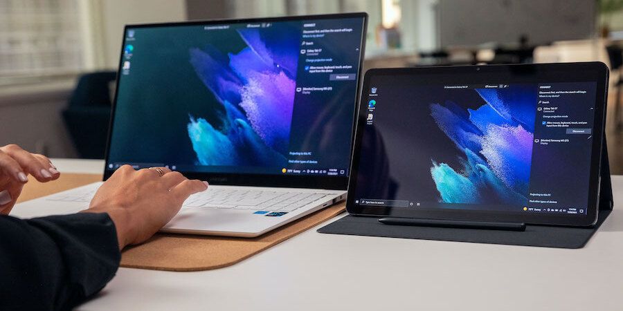 Samsung Galaxy Book laptop and Galaxy Tab tablet; the tablet is being used to mirror the laptop's screen