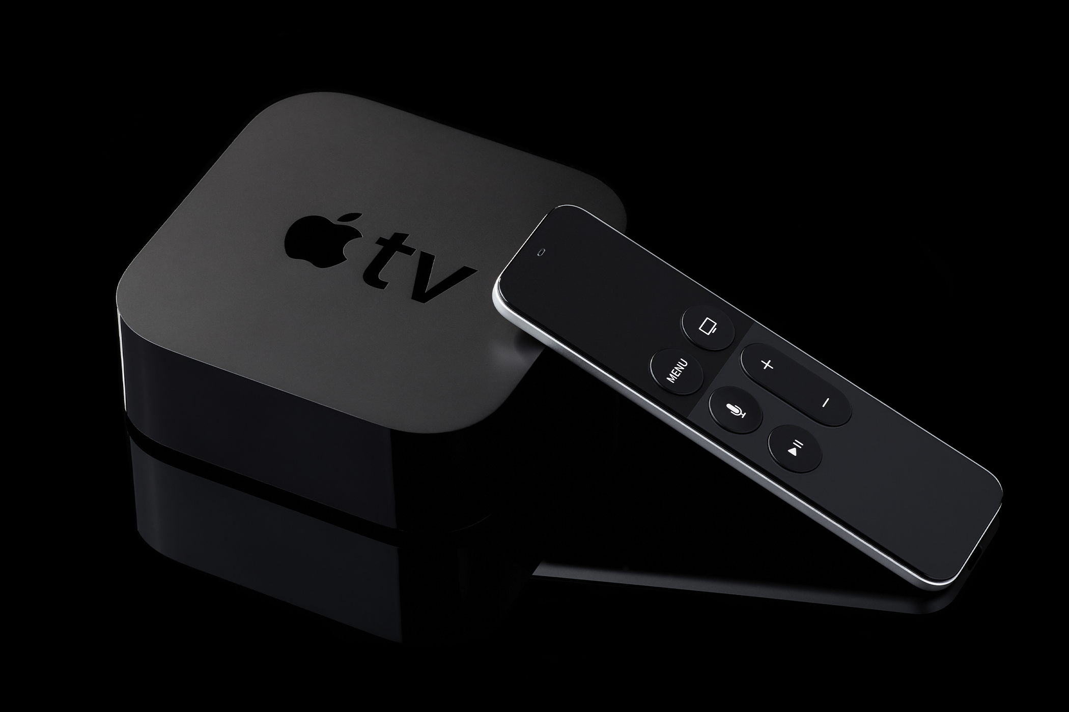 Apple TV device on a black background.