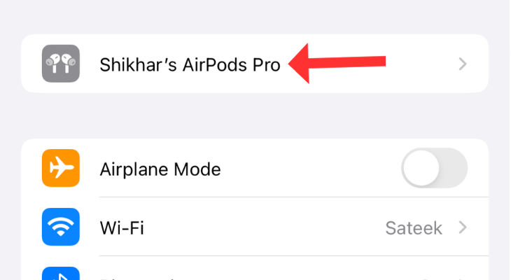 iPhone's Settings app with an arrow next to the AirPods Pro name