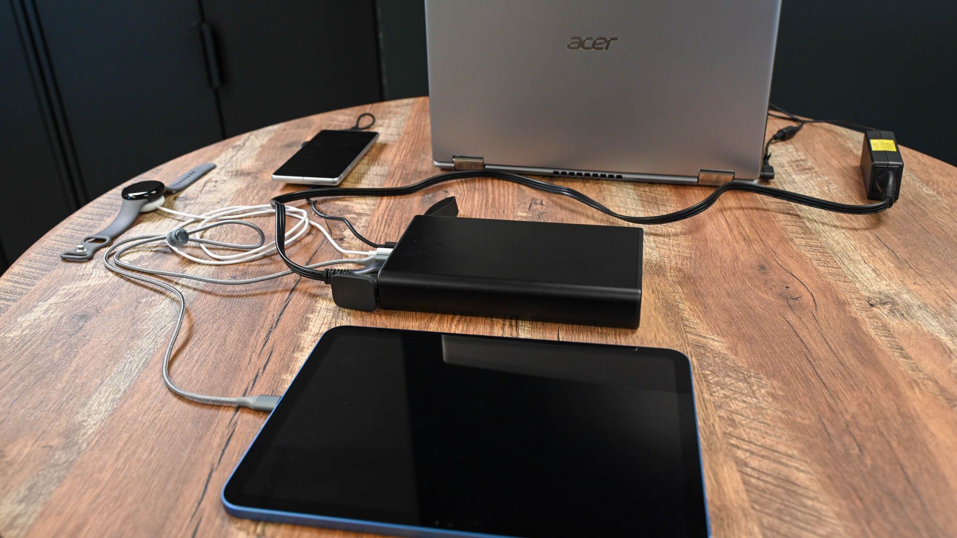 Laptop, smart watch, smartphone, and tablet charging with the Mophie Powerstation Pro AC.