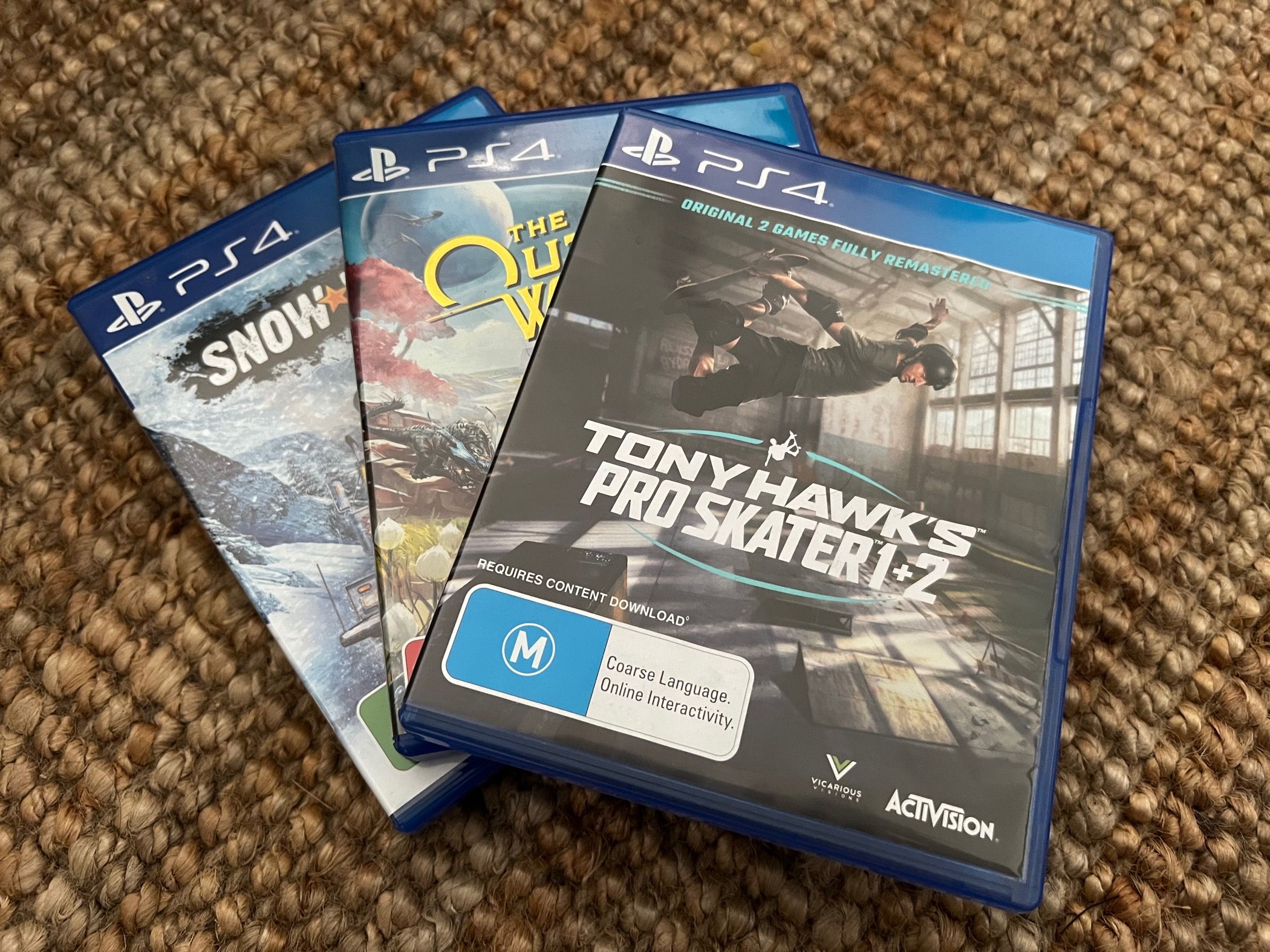 A selection of PS4 disc games: Snowrunner, The Outer Wilds, Tony Hawk's Pro Skater 1+2
