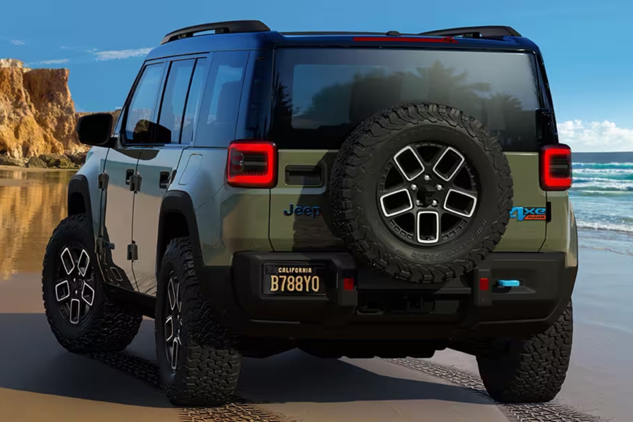 Jeep Recon 4xe EV spare tire and rear end in the mud. 