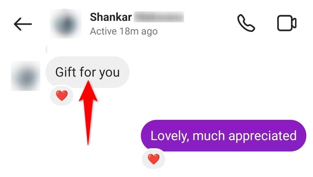 A message with a love reaction highlighted in Instagram's mobile app.