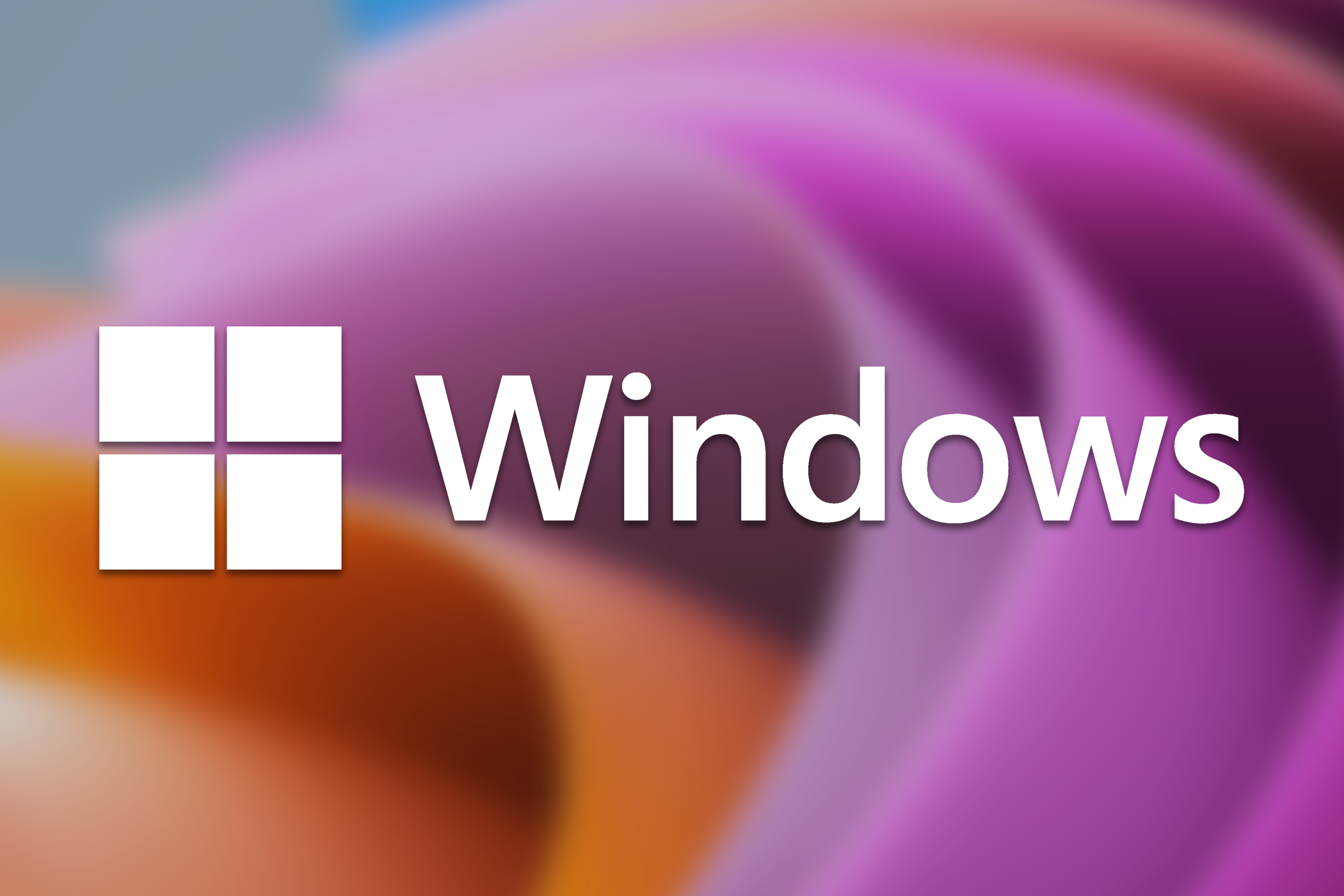 The Windows logo over a blurry desktop background.