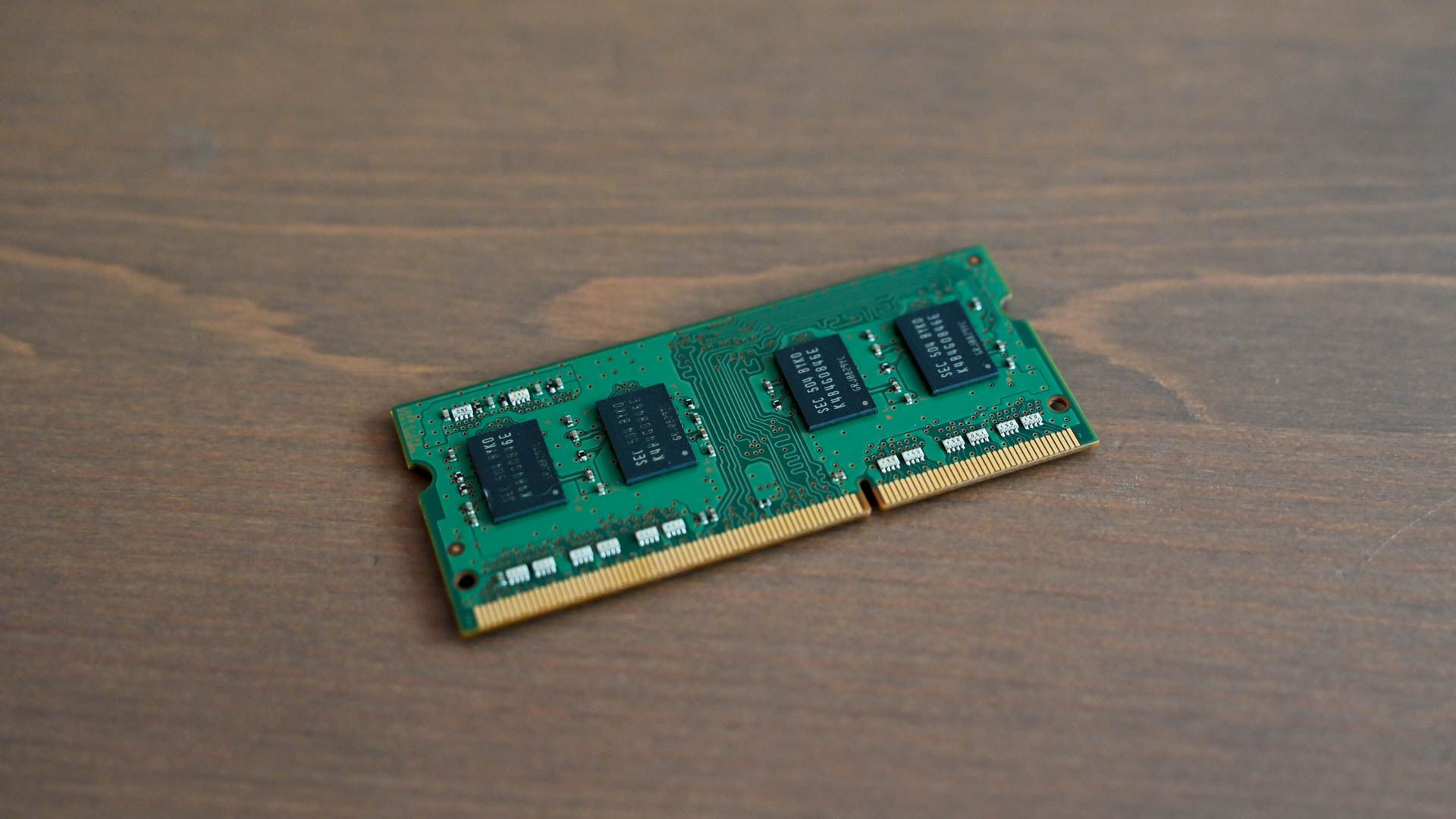 A stick of RAM sitting on a table. 