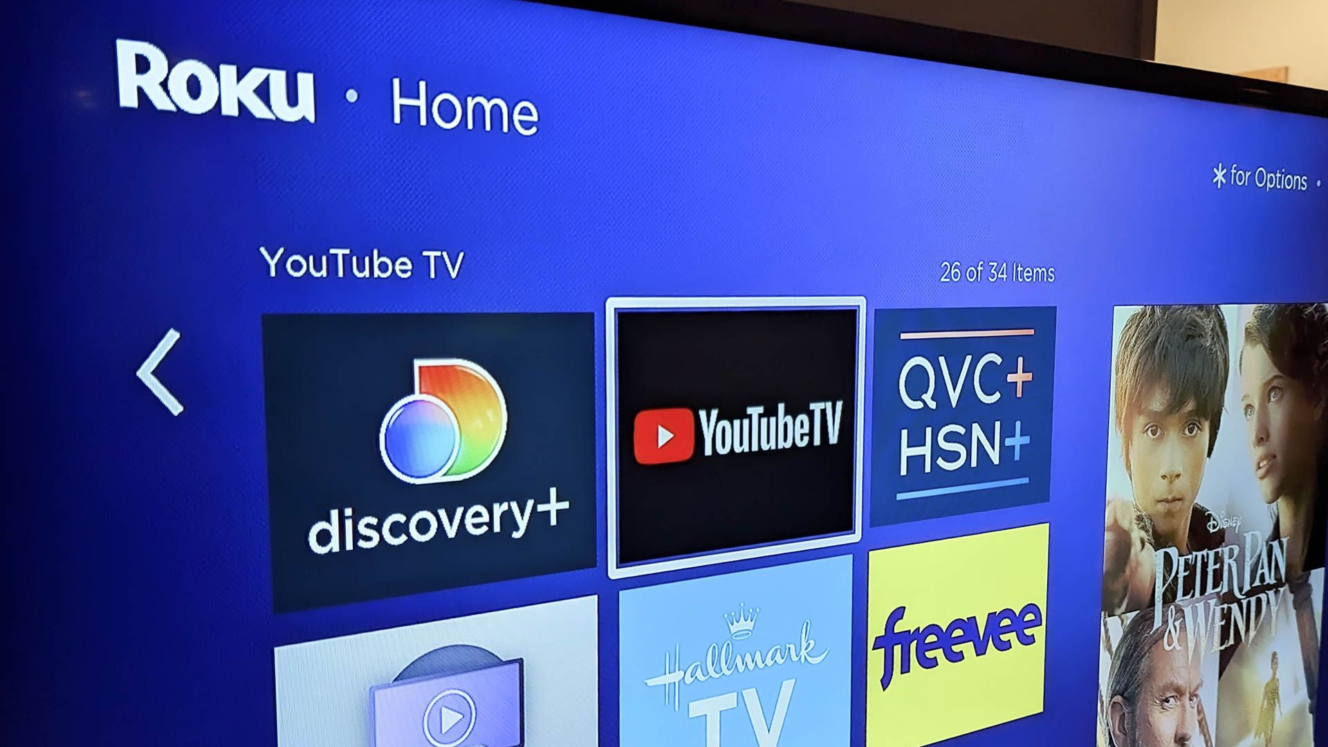 Roku home screen open on a tv with YouTube TV highlighted