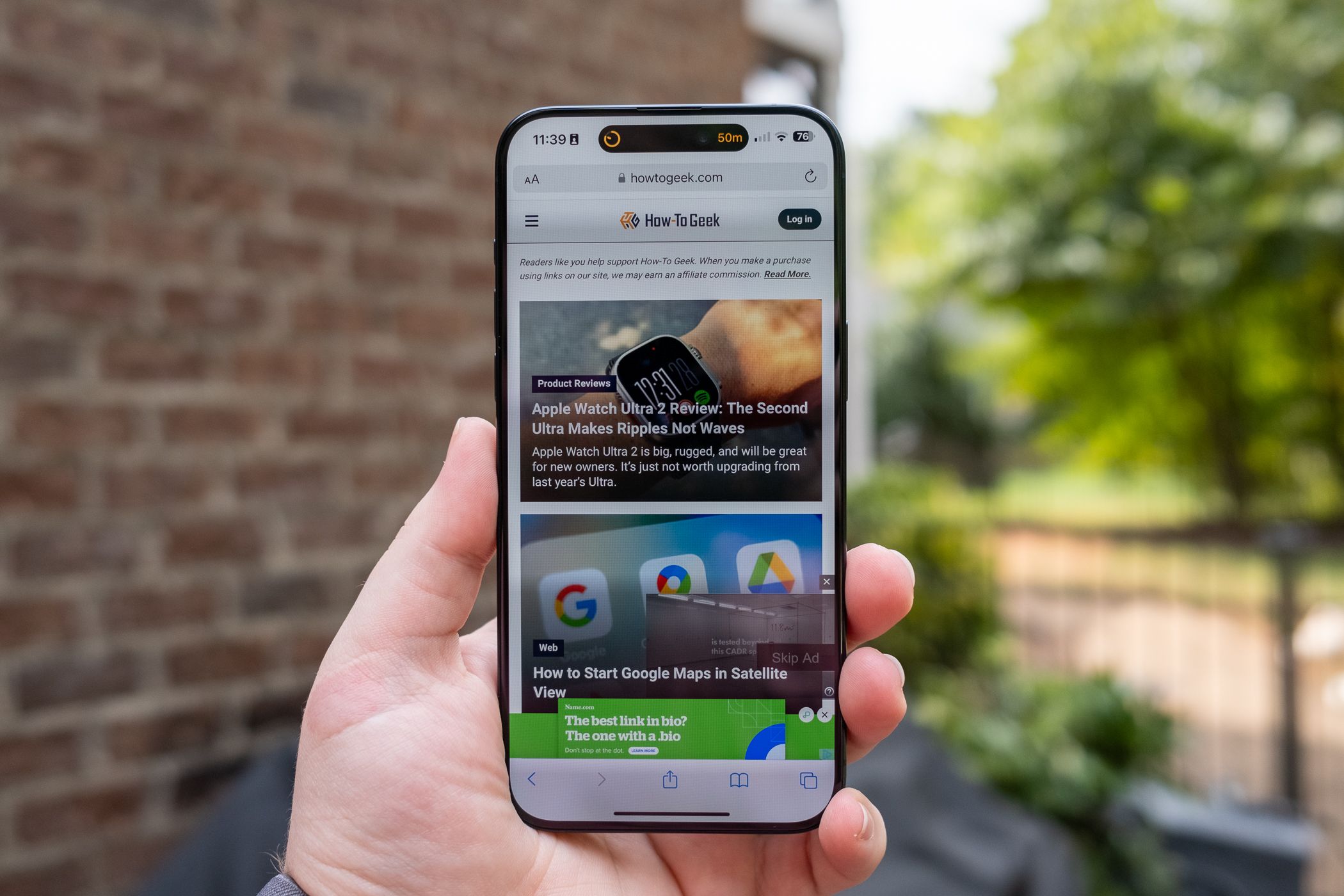 How-To Geek website running on the Apple iPhone 15 Pro Max.