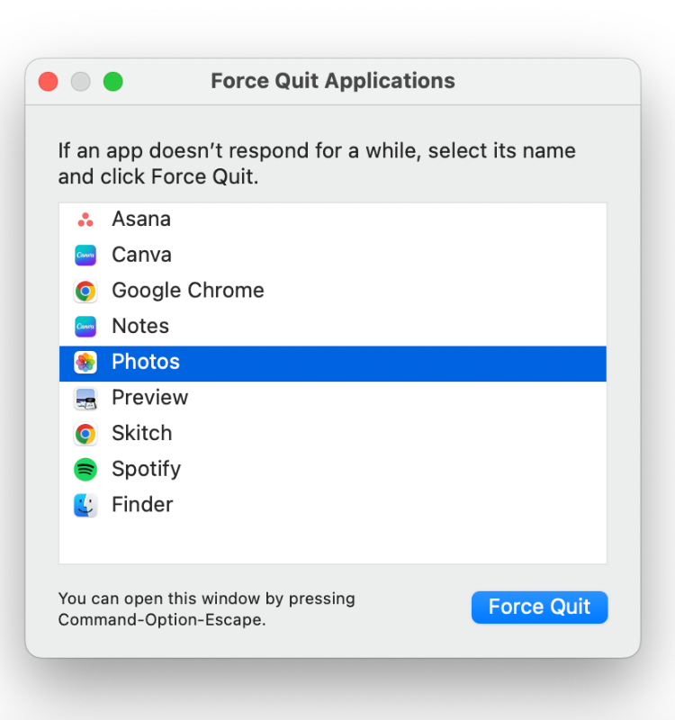 Force quit application window quitting Photos app on Mac.