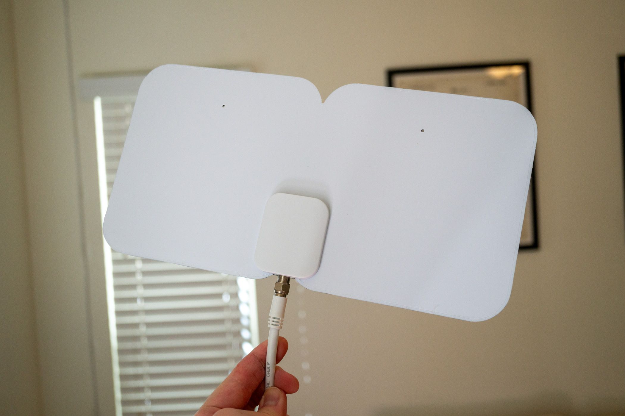 Holding a TV antenna from Tablo 4th Gen