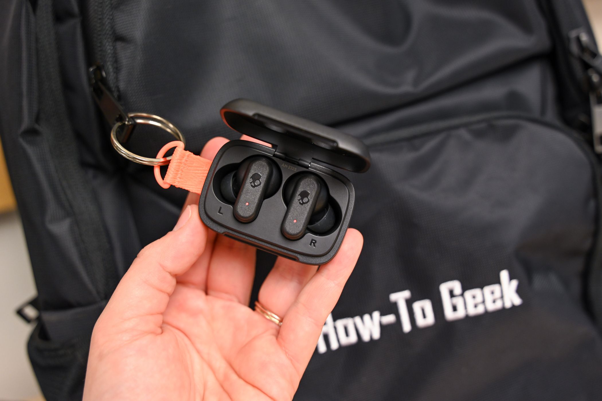 The Skullcandy Dime 3 True Wireless Earbuds on a backpack