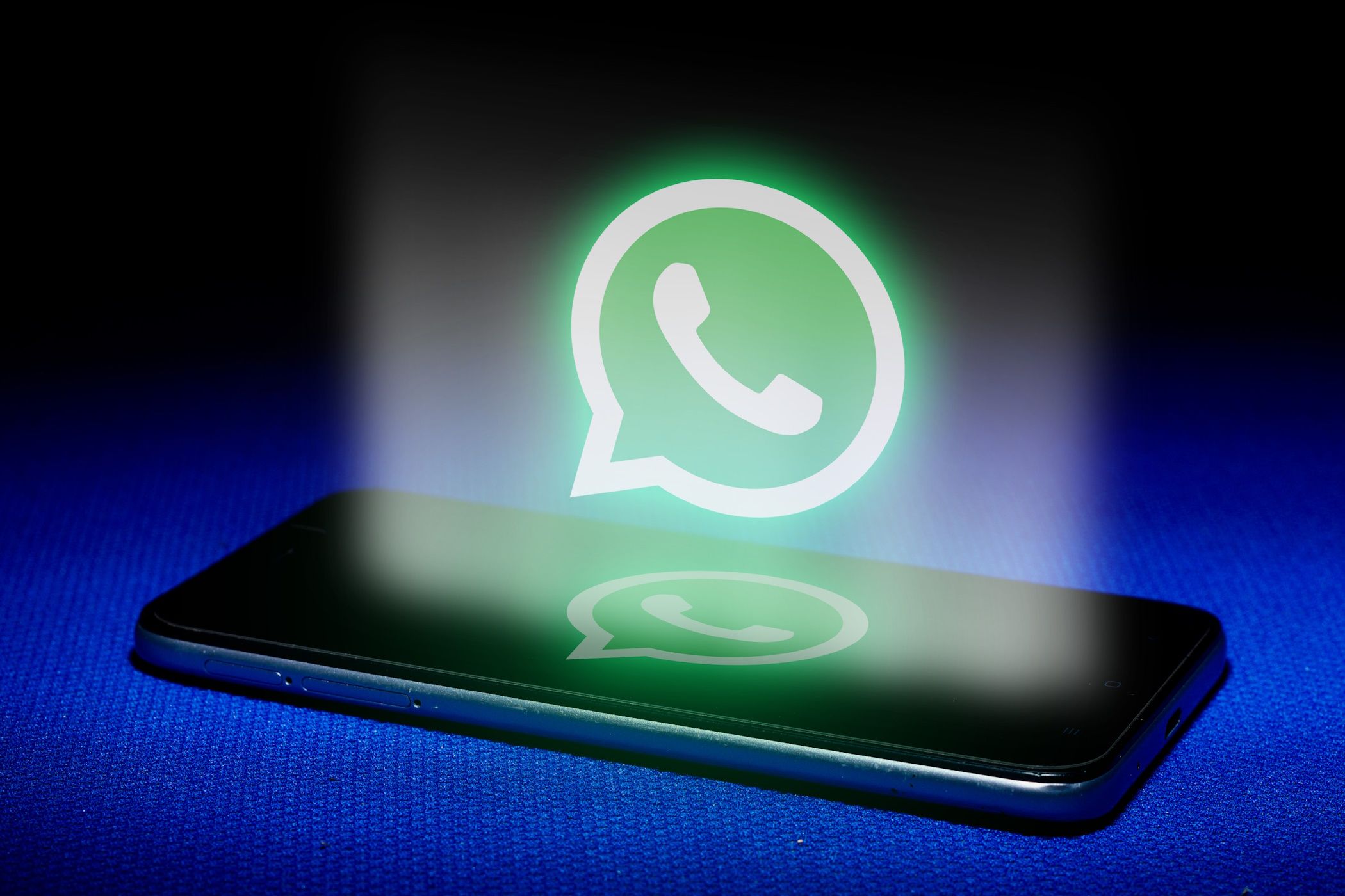 phone on blue background with whatsapp logo