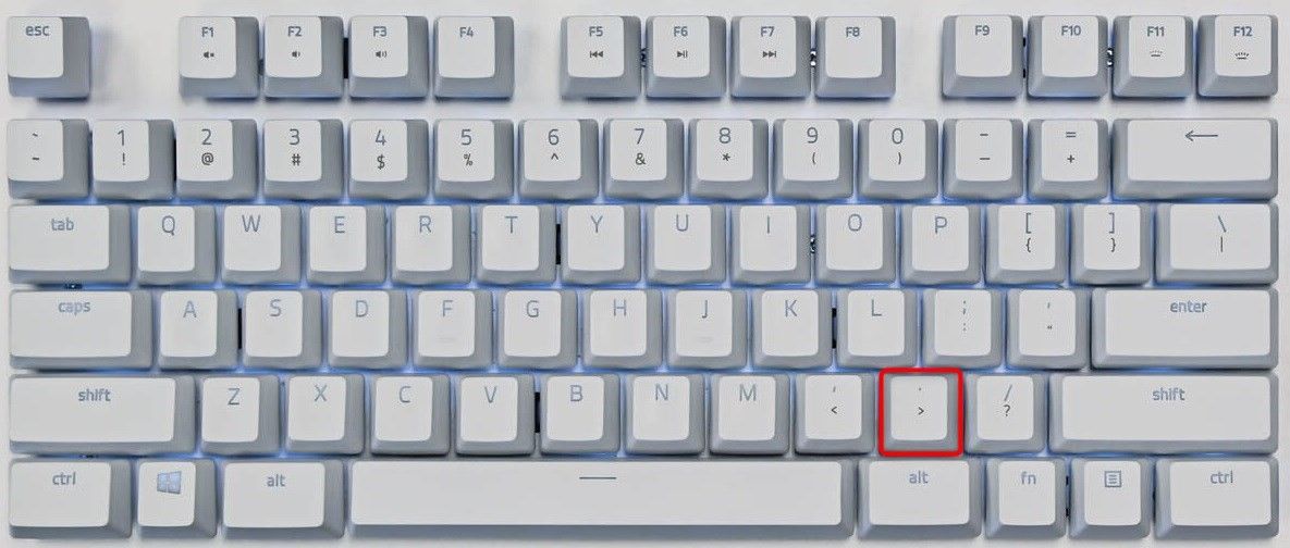 The Period or Full-stop key highlighted on a keyboard.
