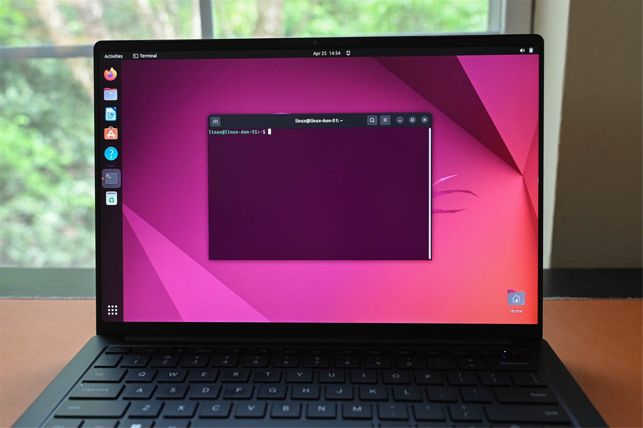A laptop running Ubuntu with a Linux Terminal open