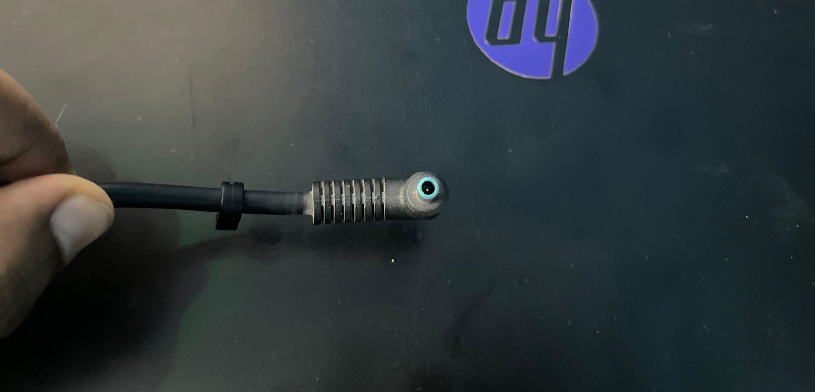The charging pin on a laptop adapter.