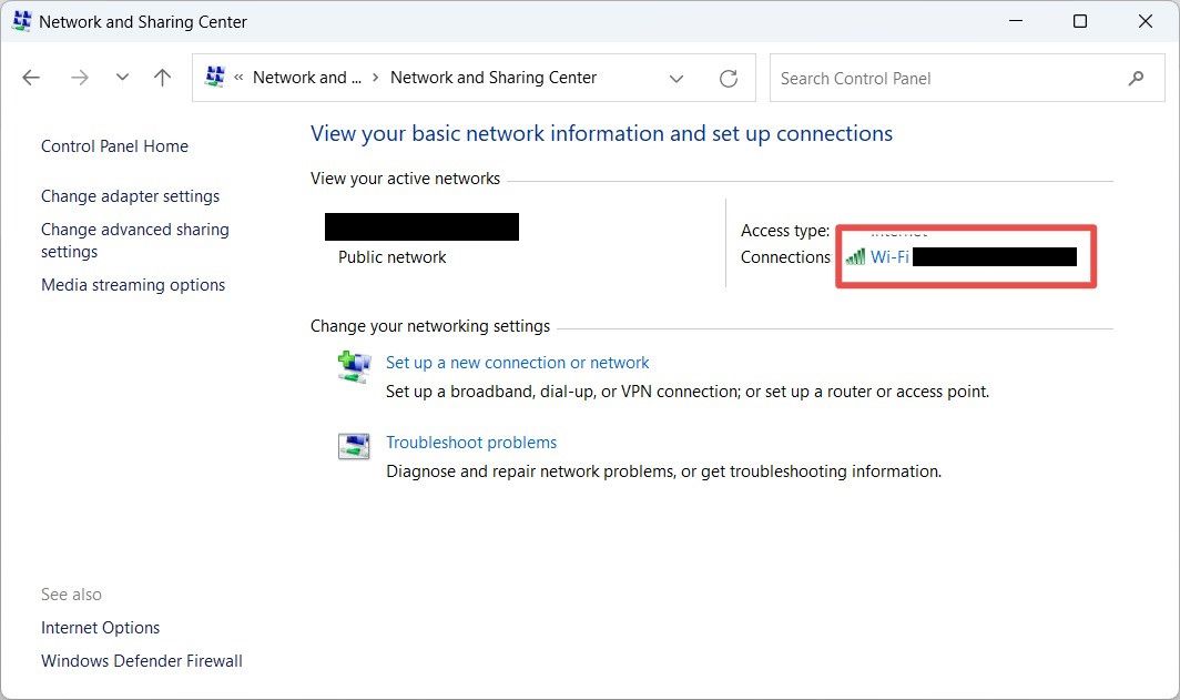 Selecting a network in the Network and Sharing Center in Control Panel in Windows.