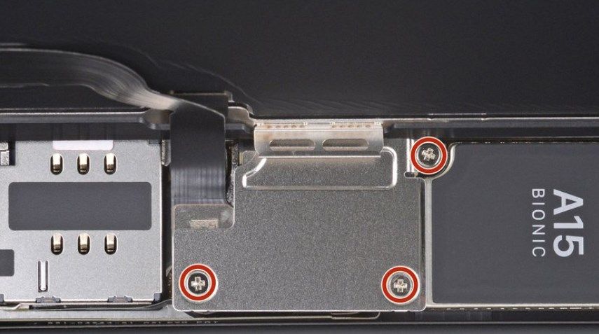 Location of the screws holding the battery and digitizer on iPhone 13.