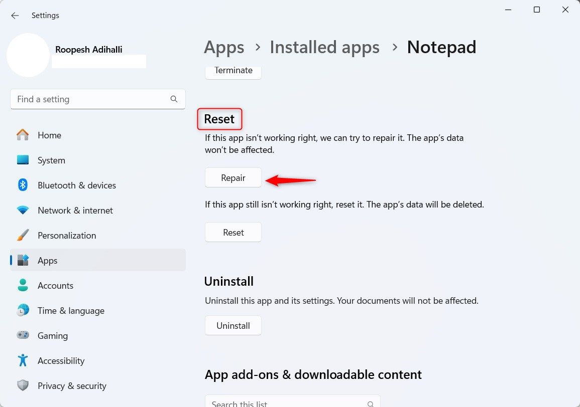 Windows 11 Notepad app section highlighting Repair button.