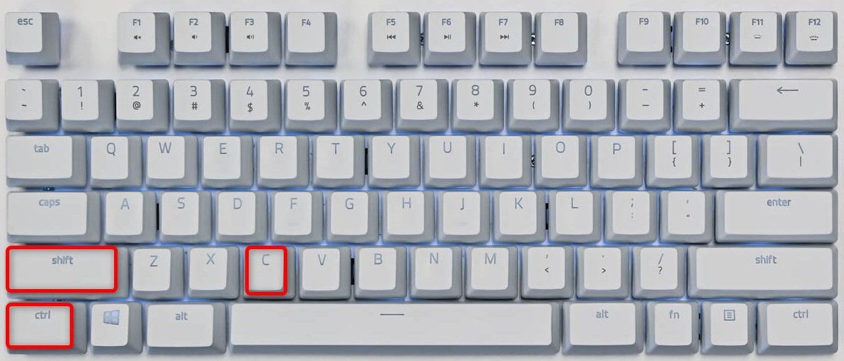Ctrl, Shift, and C keys highlighted on a Windows keyboard.