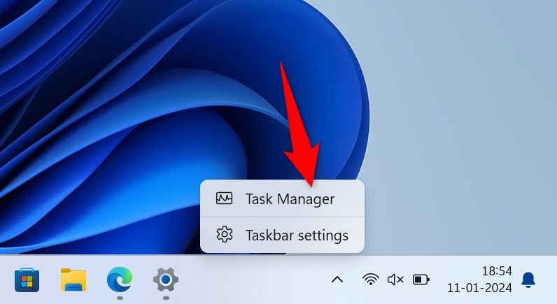 'Task Manager' highlighted on the Windows taskbar.