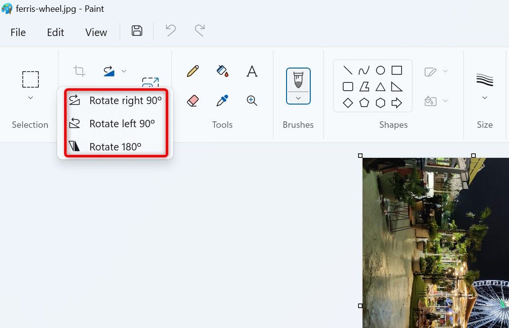 Photo rotation options highlighted in Paint.