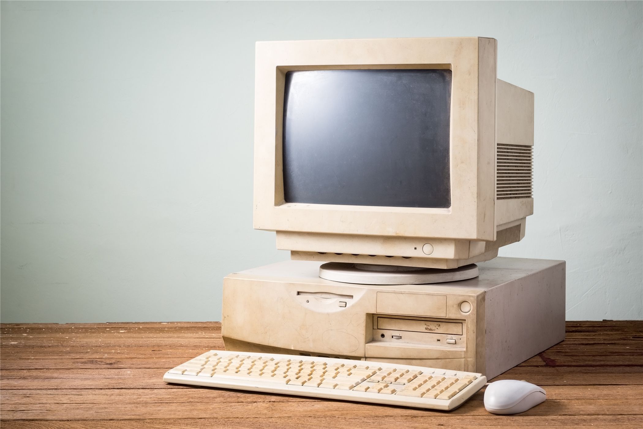 An old beige PC with a CRT monitor. 