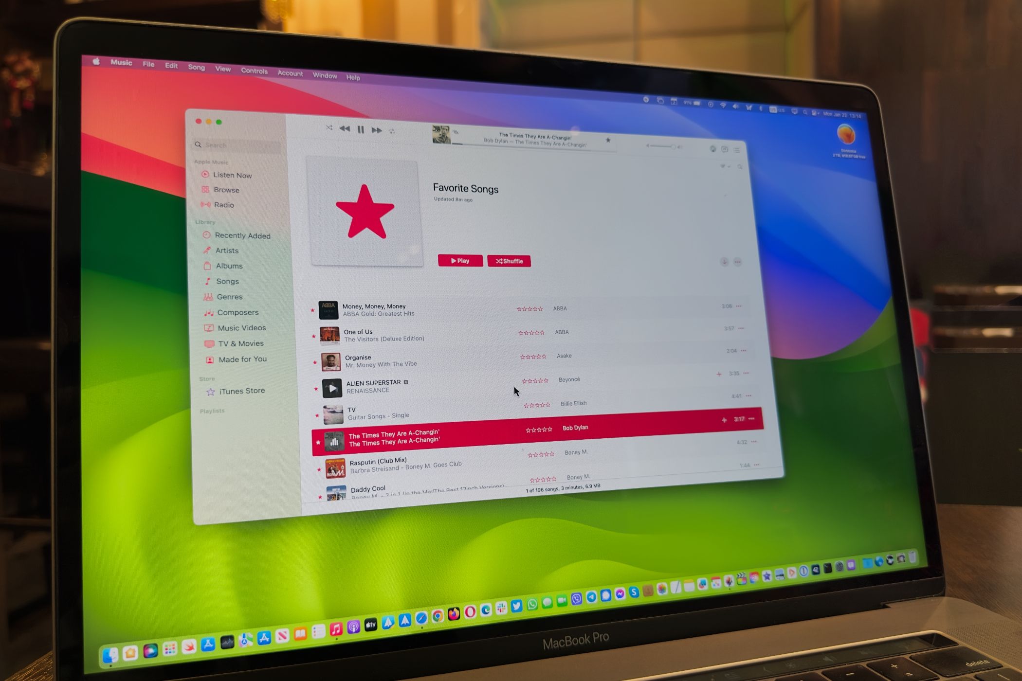 Music app on MacBook Pro showcasing the Favorite Songs playlist.