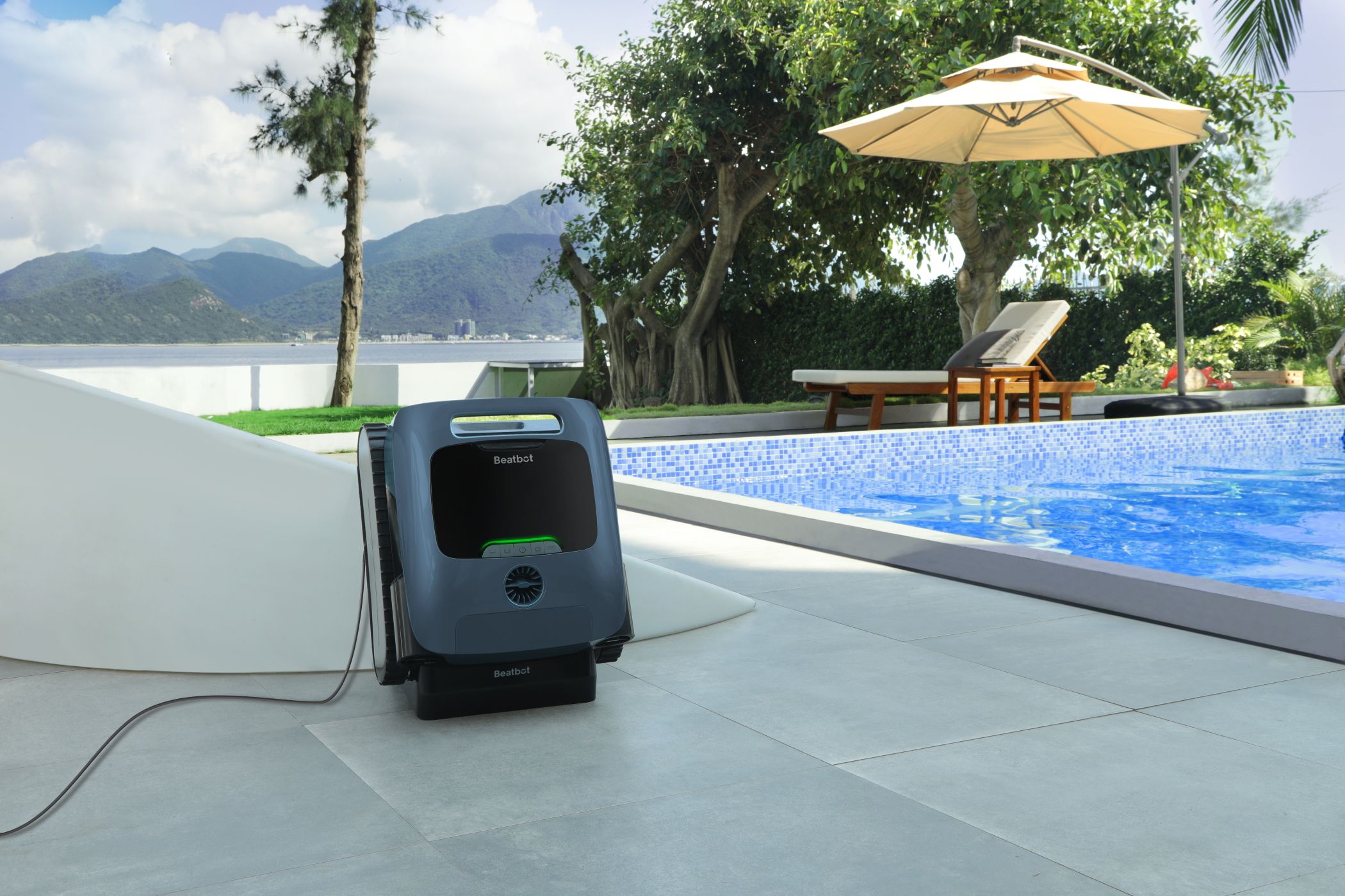 The Beatbot AquaSense Pro Charging on its Dock Next to a Pool