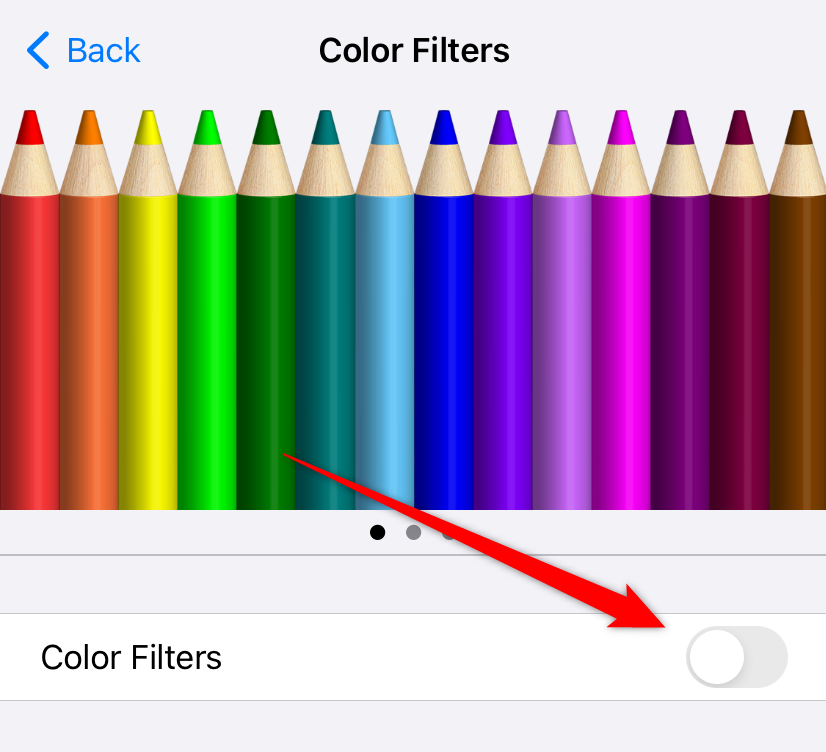 Toggling the 'Color Filters' setting on in the iPhone Accessibility settings.