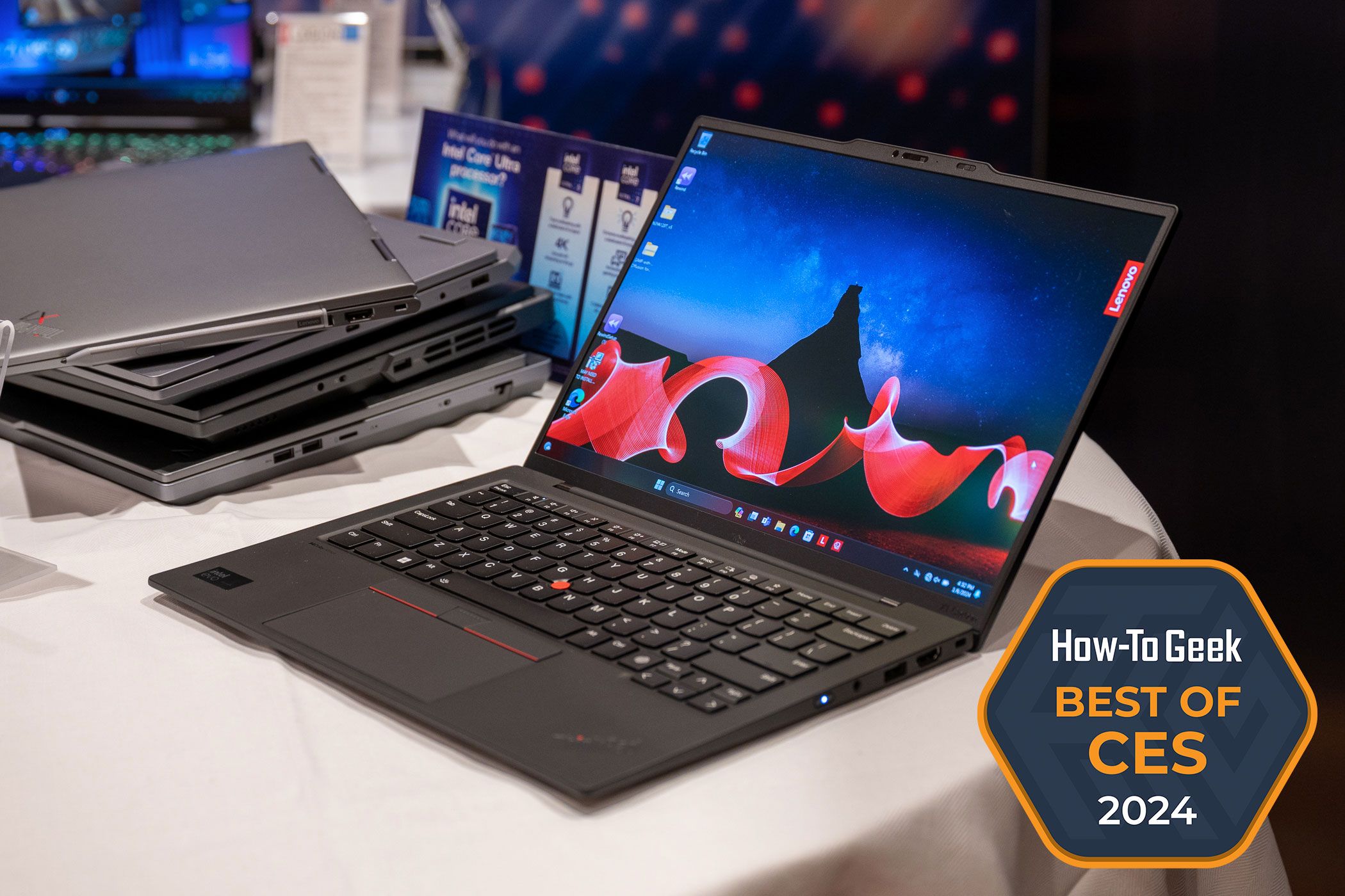 Lenovo ThinkPad X1 Carbon Gen 12 sitting on a table open showing its screen and keyboard with Best of CES 2024 badge