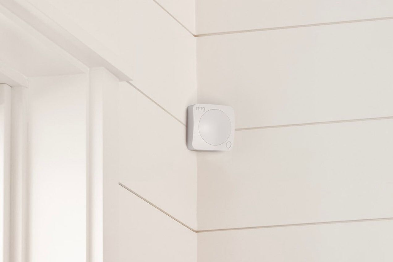 A Ring Alarm Motion Detector mounted on the exterior of a home.