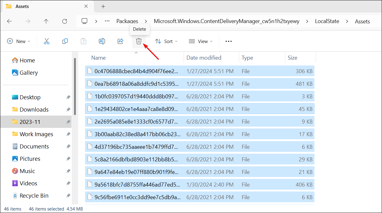 Windows 11 File Explorer showing deleting of Windows Spotlight asset files.