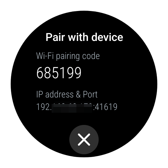 Wi-FI pairing code, IP address and port displayed on a Wear OS smartwatch.