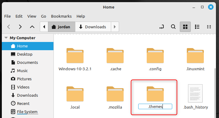 Creating a folder named .themes in a Linux home directory using a file manager.