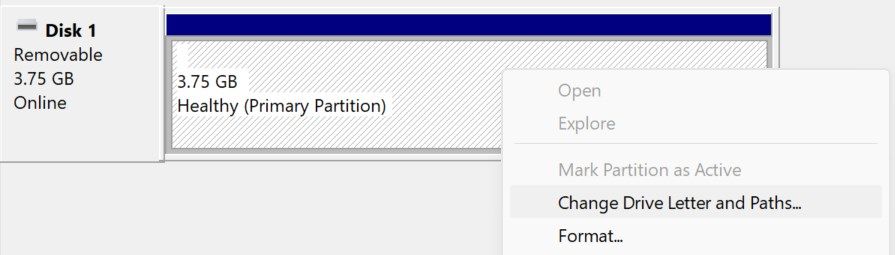 Opening the settings to change drive letter in Disk Management.