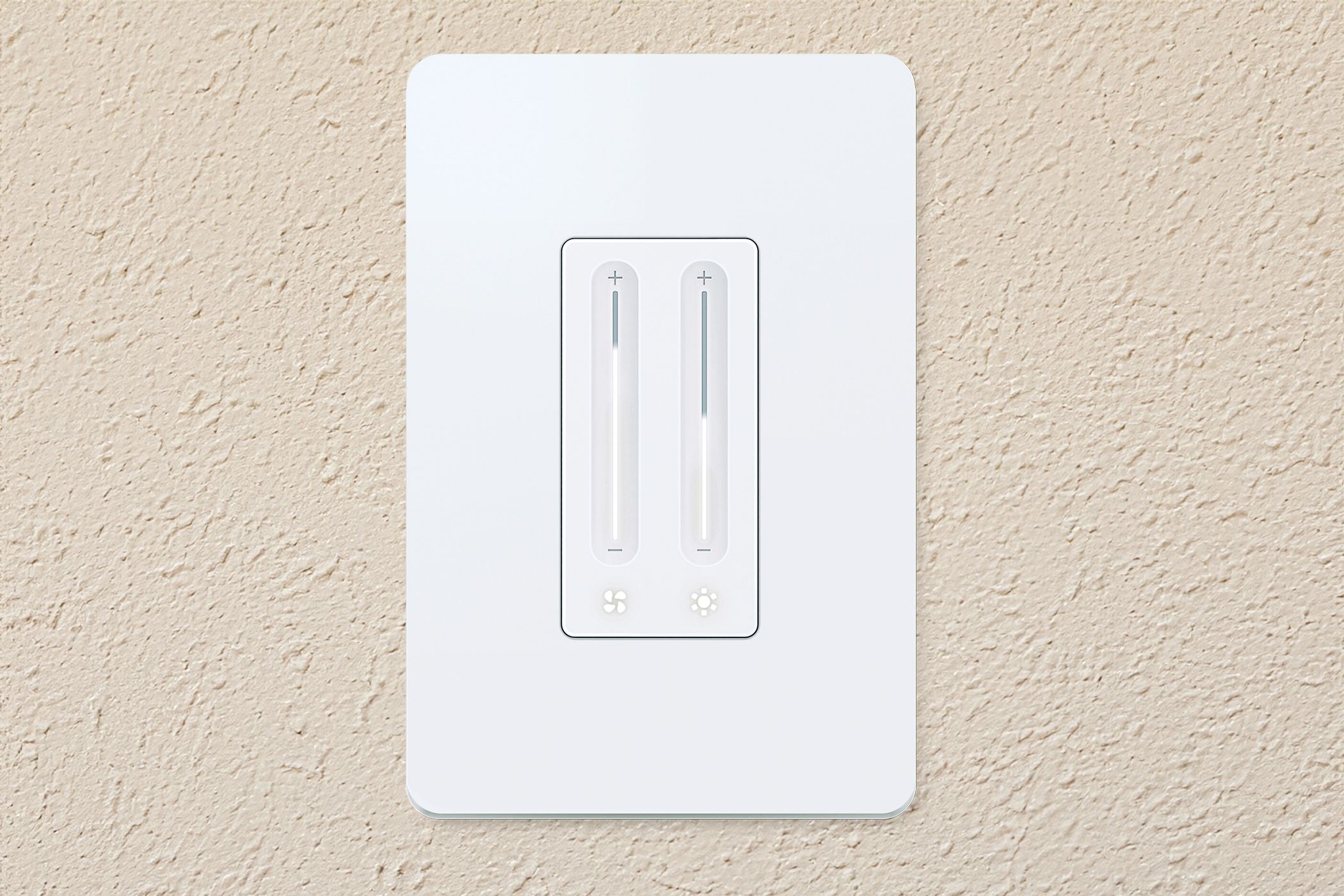 The TP-Link Kasa Smart Fan Control and Dimmer on a wall.