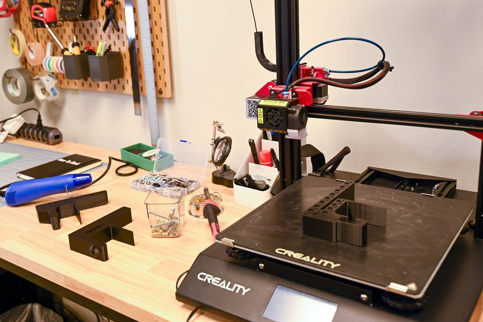 3D Printer on a workbench with soldering materials