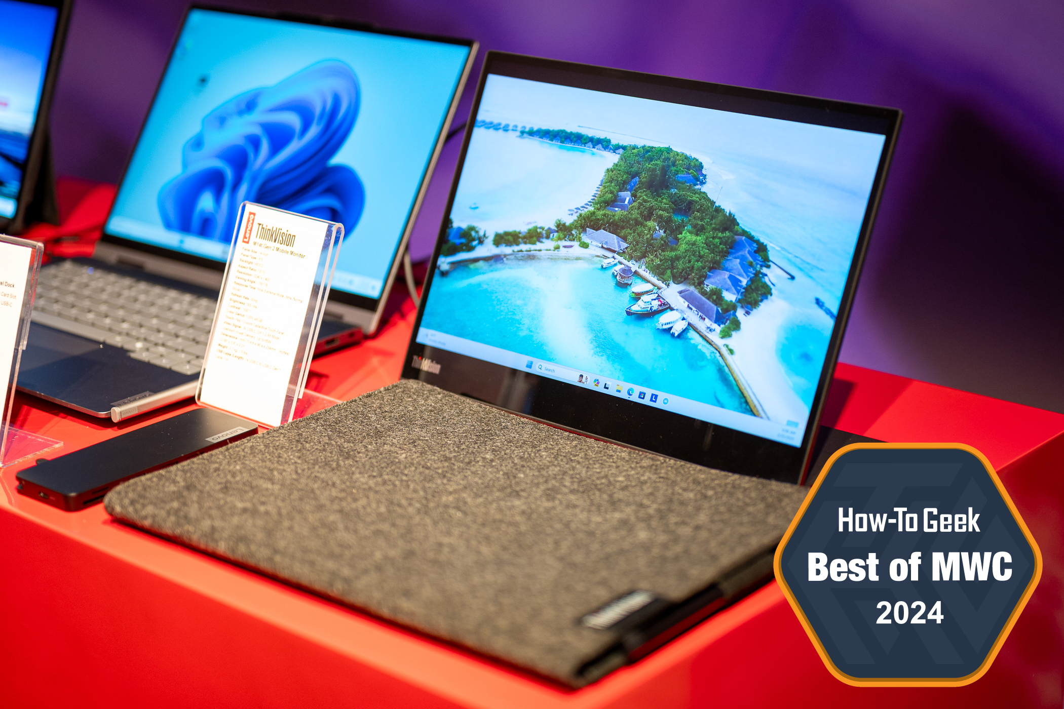 Lenovo ThinkVision M14t Gen 2 Mobile Monitor powered on and sitting in front of its travel case