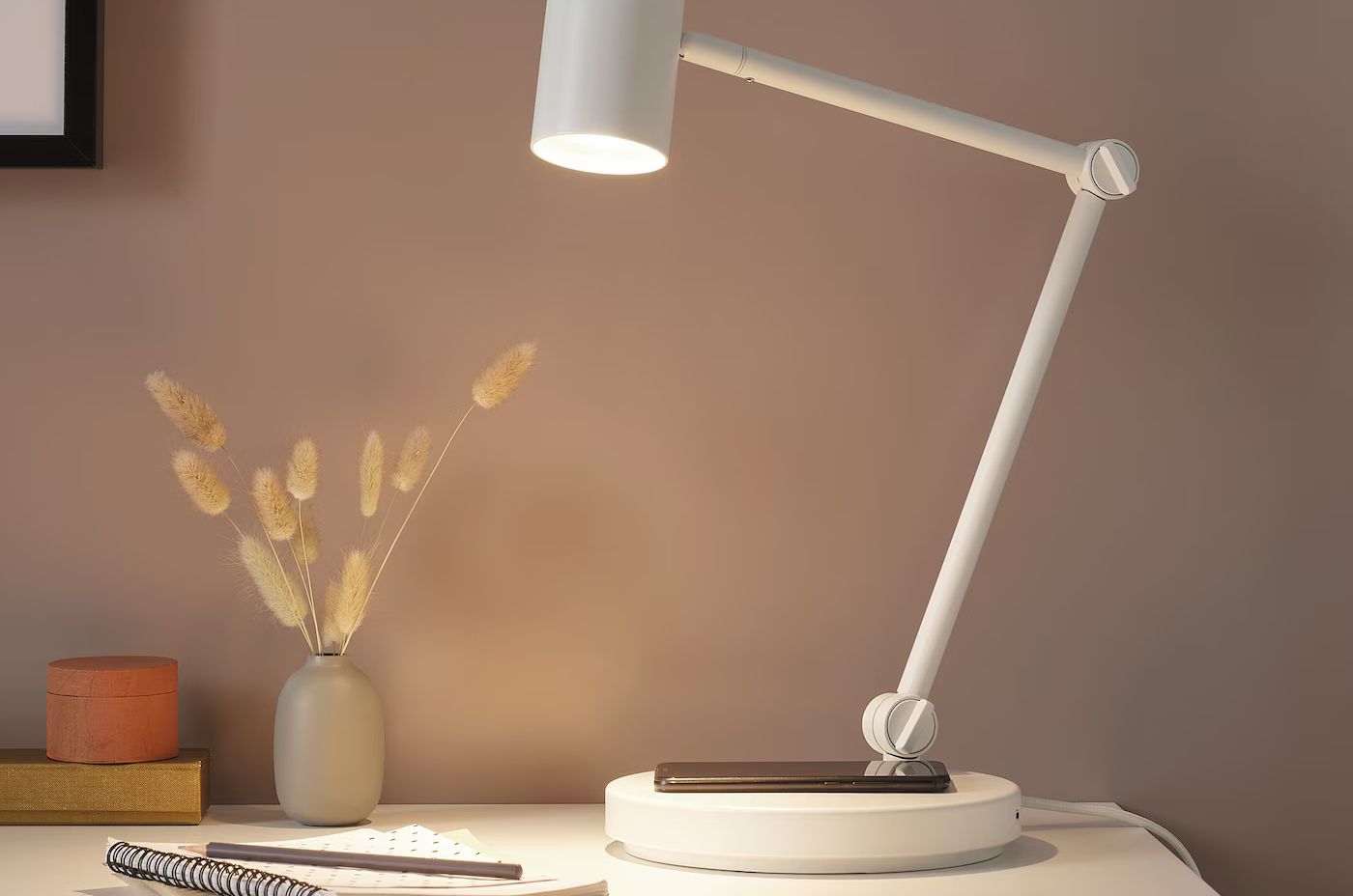 Nymane work lamp with wireless charging.